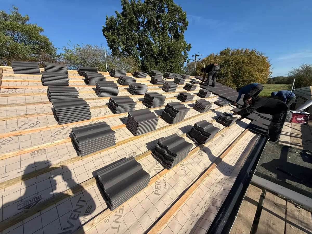 New concrete interlocking tiles loaded out on fresh battens