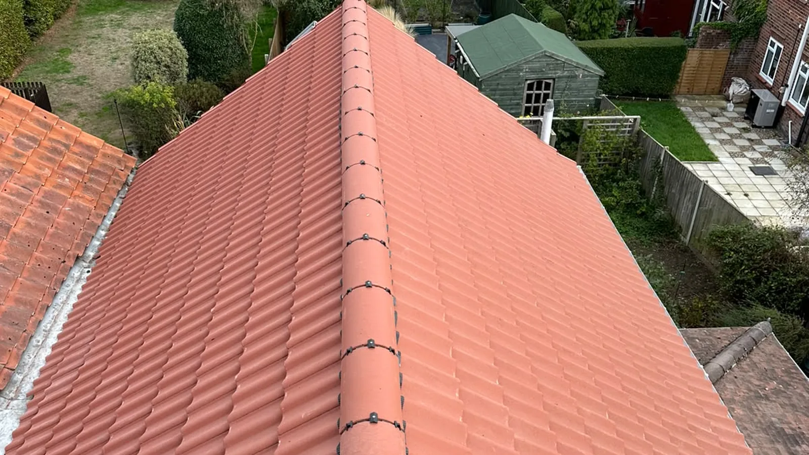 Newly finished red clay pantile roof on a house in Holt