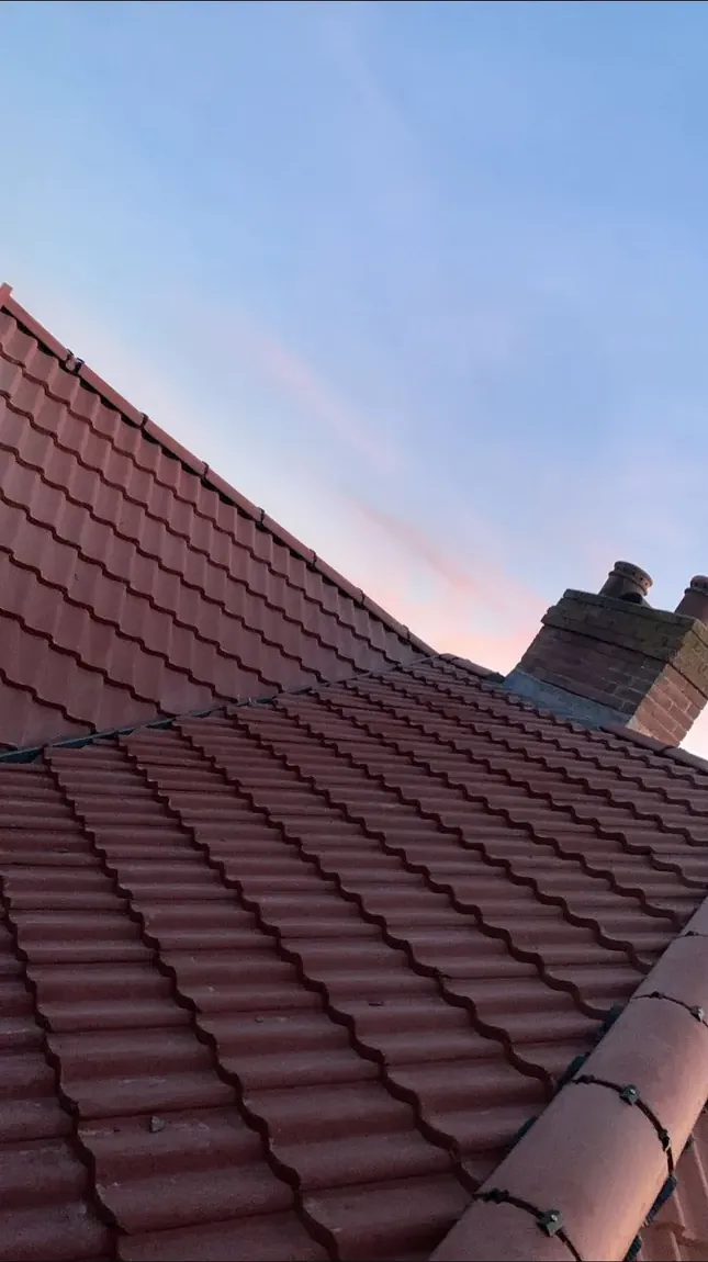 Finished red pantile roof at dusk on a house in Norfolk