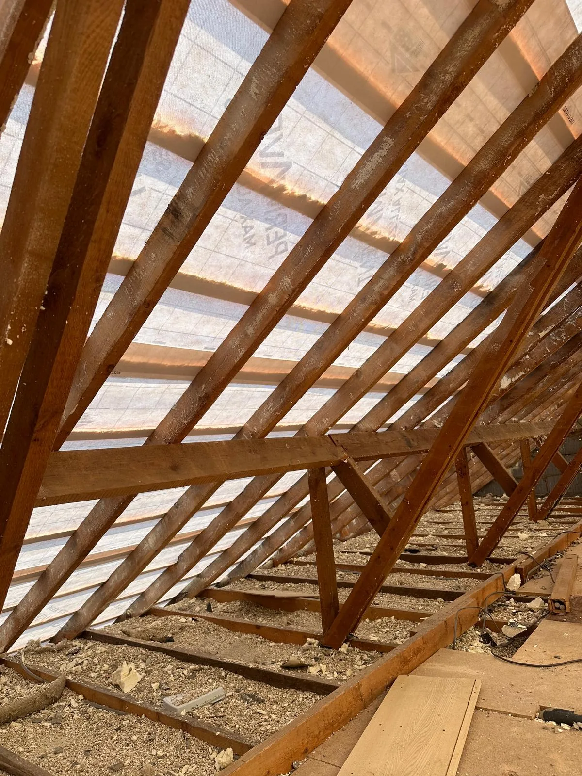 Clean loft after foam removal with breathable membrane between the rafters