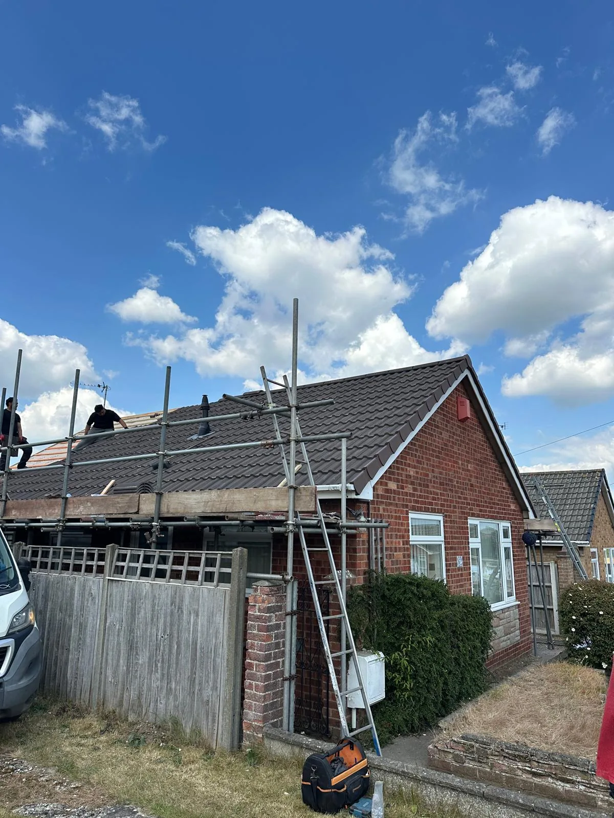 Finished dark tiled bungalow roof after spray foam removal and re-roofing