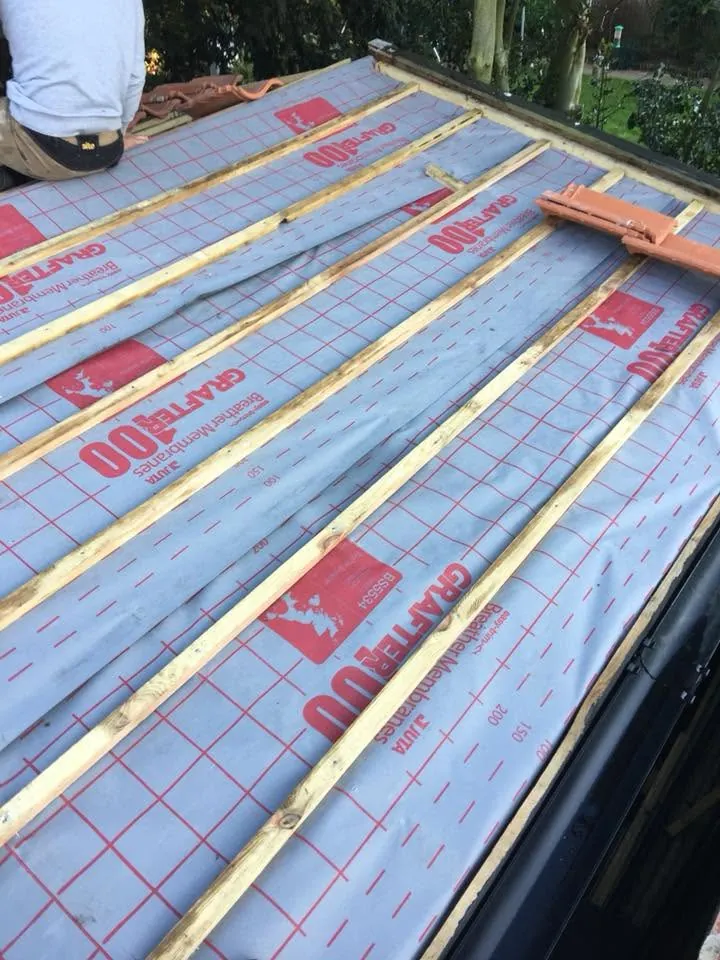 Treated battens fixed over breathable membrane ready for clay tiles